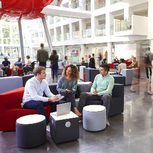 students sitting in lobby chatting