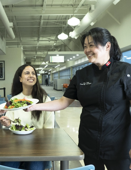 woman serving salad