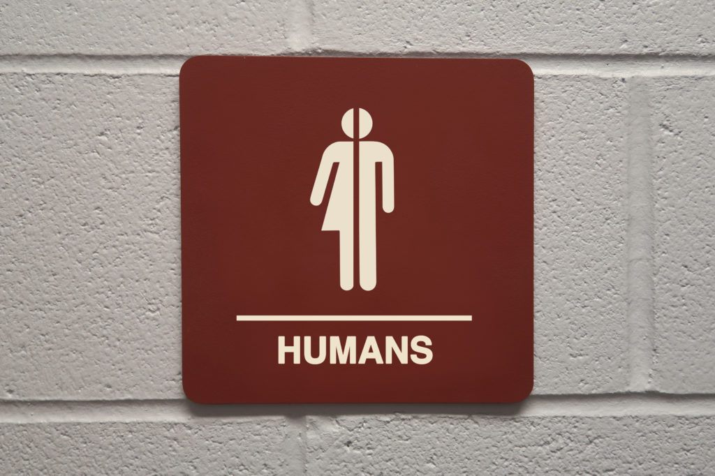 Un panneau de toilettes pour humains