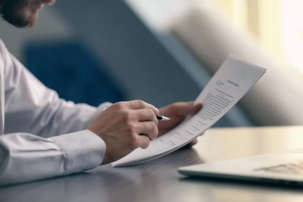 Man reviews document intently