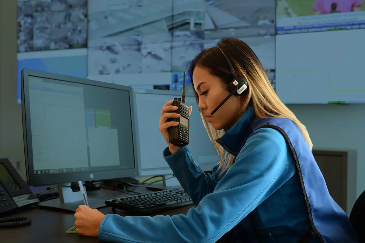 customer service representative sitting at desk on the phone