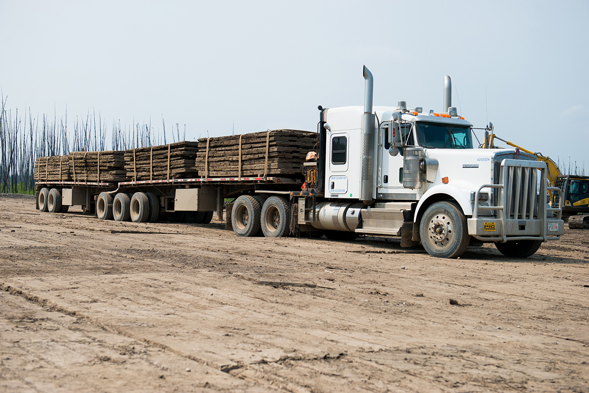 large truck carrying access mats