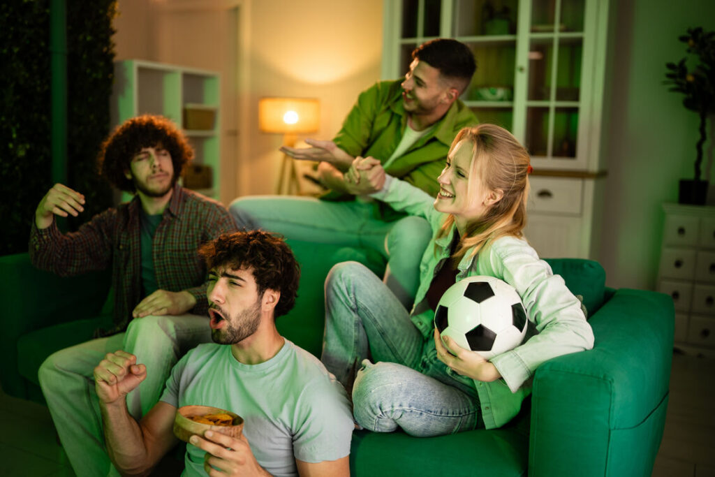 Friends enjoying a FIFA watch party with food